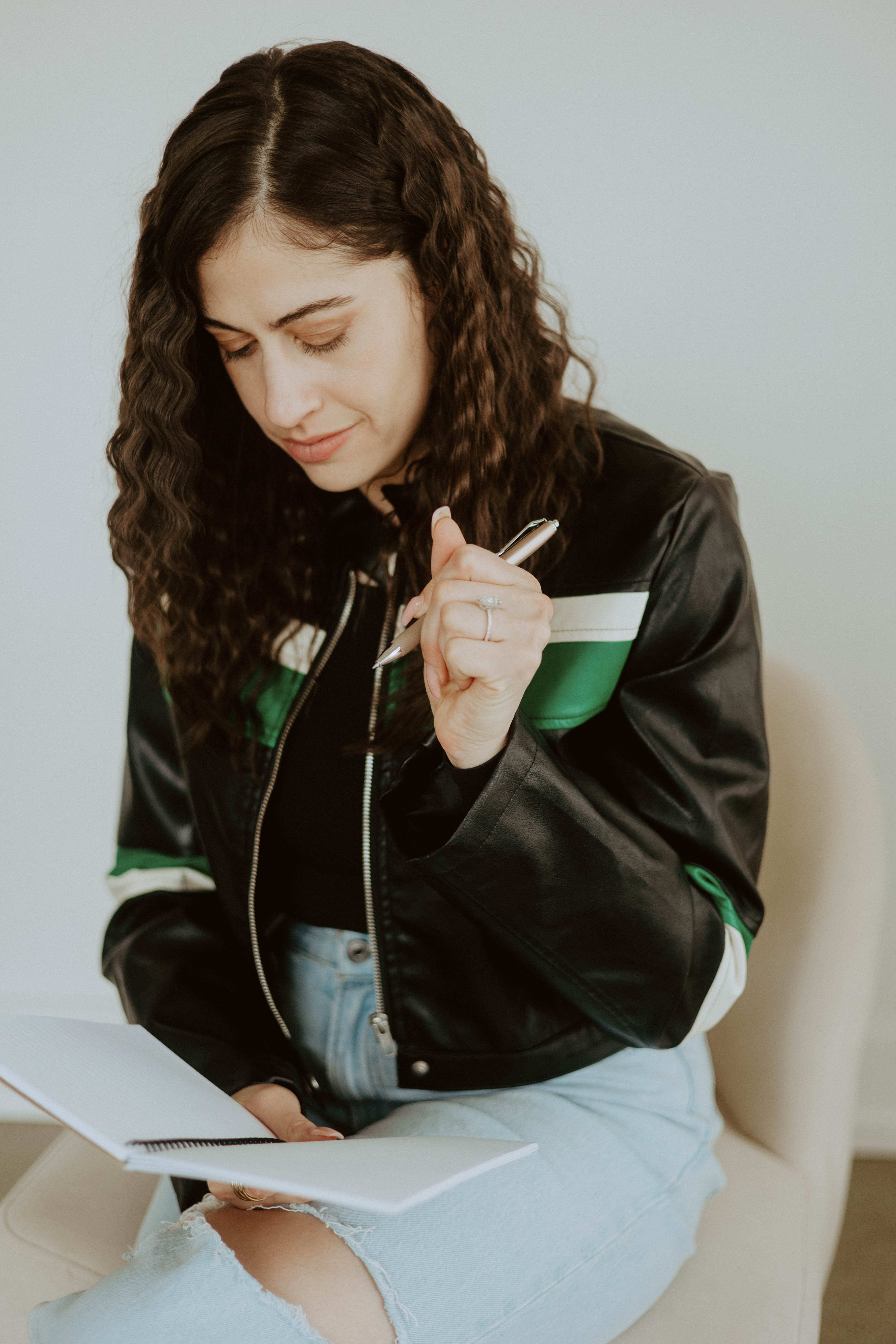Natalie reviewing notes and working through a decision.