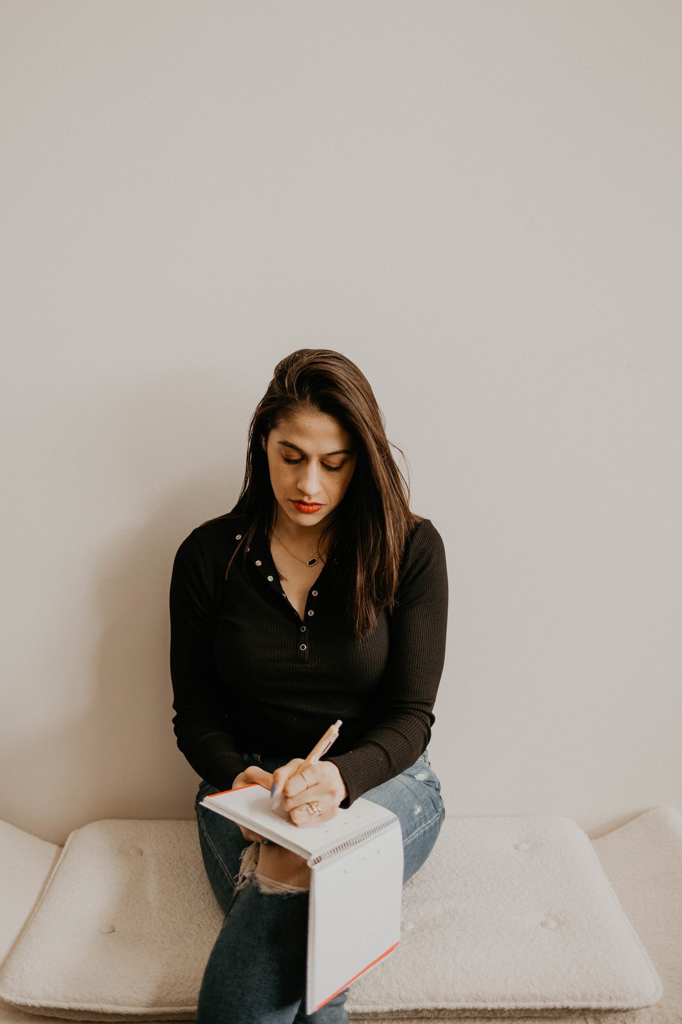 Natalie working through strategy notes on a printed document.